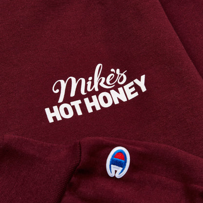 Mike's Hot Honey Logo on red champion sweatshirt