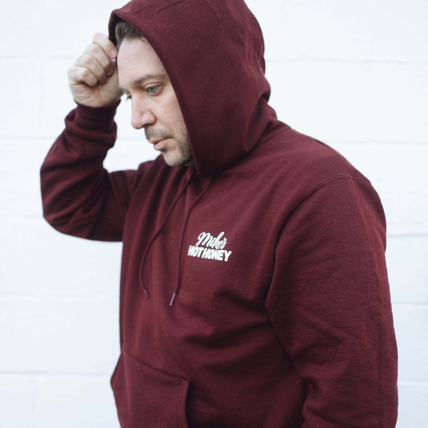 Man wearing Mike's Hot Honey pullover sweater